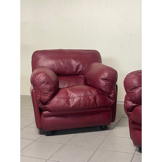 A pair of armchairs from the "Poppy" series designed by Tito Agnoli and produced by Poltrona Frau in the 1970s. Extremely...