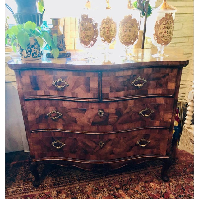 An 18th century Pearwood commode from France. Gorgeous! Beautiful patina. Brass drawer pulls with shell shape accent.