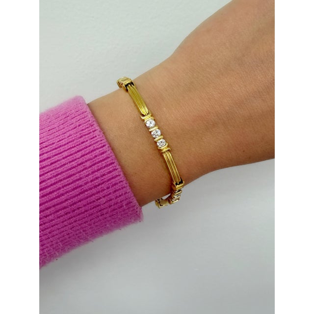 A refined creation by Tiffany & Co., this bracelet exemplifies contemporary elegance. Crafted in luxurious 18k yellow...