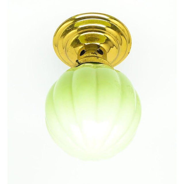 The plafond was produced in Germany in the 30s. It is made in the art deco style. The construction is brass, glass...