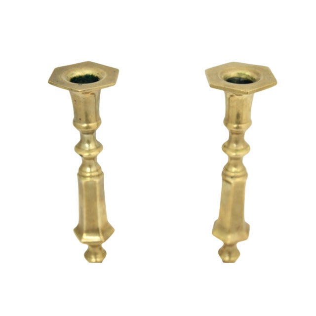 A substantial pair of 10 inch vintage brass candlesticks with square bell style heavy stable bases and octagonal bobeches....