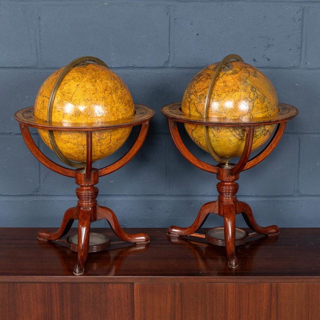 An exceptional pair of Cary’s 12-inch terrestrial and celestial globes, published in 1821, and raised on elegant mahogany...