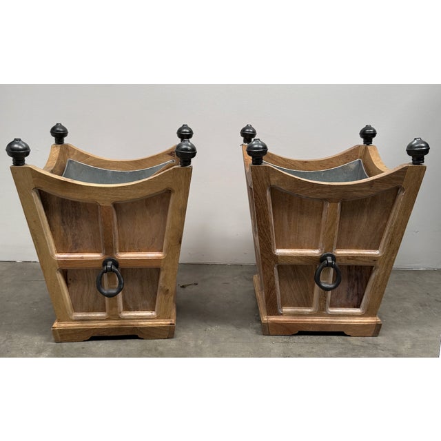 Two tuxedo wooden planters in natural finish with galvanized liners. Liners have a drain with a spout to direct the water...