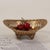 This vintage-inspired dish features a weathered gilded finish (emulating aged brass) with a curved, boat-shaped...