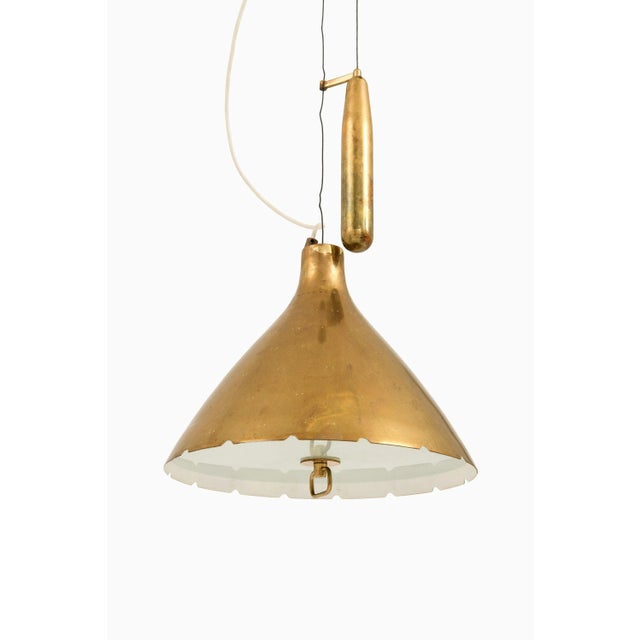Height adjustable ceiling lamp in brass and glass by paavo tynell, 1950's additional information: material: brass, glass...