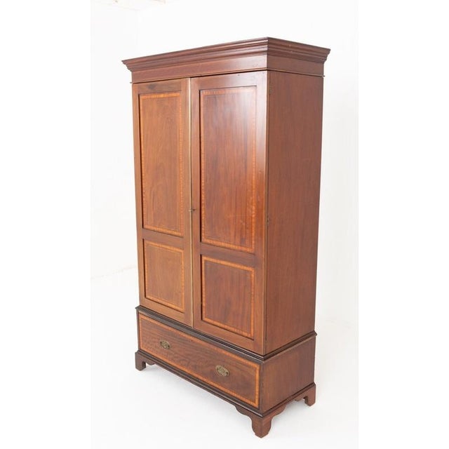 Handsome Sheraton Revival mahogany two door wardrobe Beautifully figured flame mahogany throughout Satinwood crossbanding...