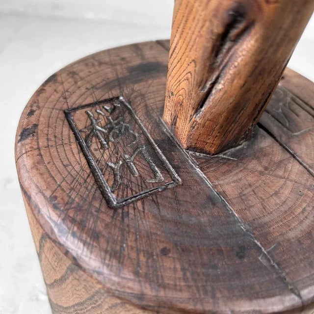 This wooden object was formerly used as a mallet to soften straw. The hammer bears two marks on the upper side. It is...