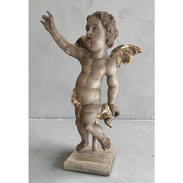 18th Century Large Bavarian Baroque Polychrome and Parcel-Gilt Carved Wood Putto.. H 31” x W 20” x D 9.5” This monumental...