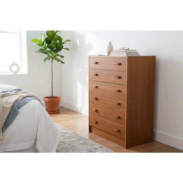 This beautifully crafted mid-century modern teak dresser showcases timeless Scandinavian design and exceptional...