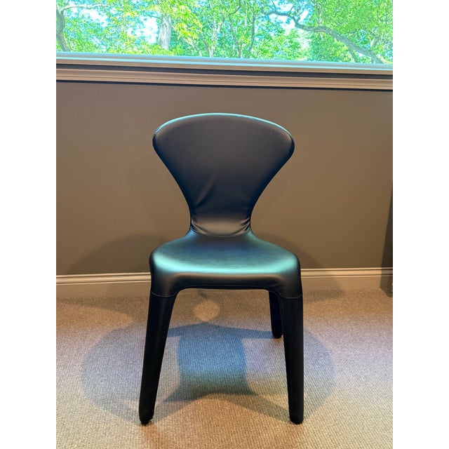 A set of 6 like-new, sturdy, black leather dining room chairs, designed in Italy by and purchased from Roche Bobois in...