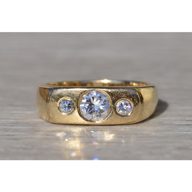 The Jeffree: Gentlemen's 14K Gold Three Stone Diamond Ring. Expertly crafted in 14 karat yellow gold is this men's vintage...