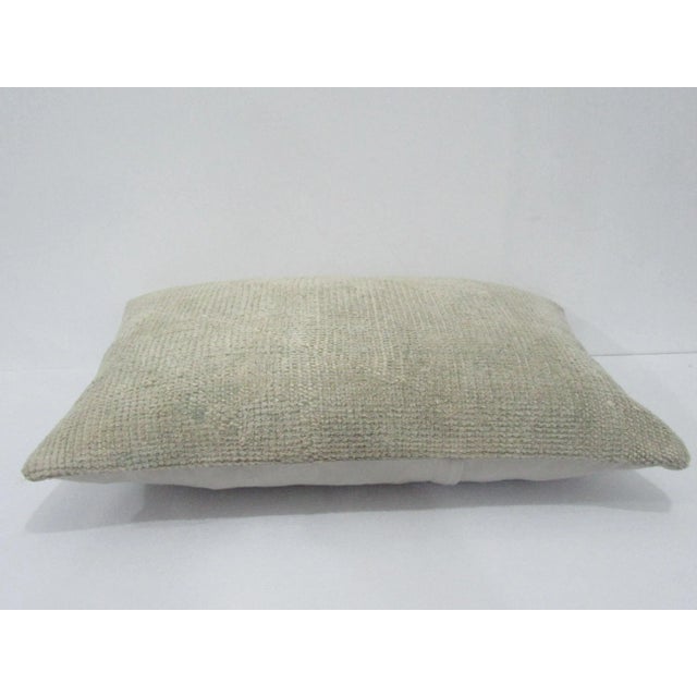 Decorative pillow cover made from a vintage Turkish handknotted rug. Backed with good quality cotton fabric. Pillow...