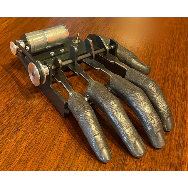 This is the "Fingers" Mechanical Sculpture created by artist Nik Ramage. The piece features resin-cast fingers that...