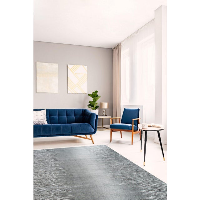 Tessa Maya Gray Hand Knotted Wool Rug, Country of Origin: India. This exceptional piece represents the finest contemporary...