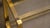 Metal Mid 20th Century Pair of Brass & Smoked Glass Art Deco Sofa End Tables For Sale - Image 7 of 11