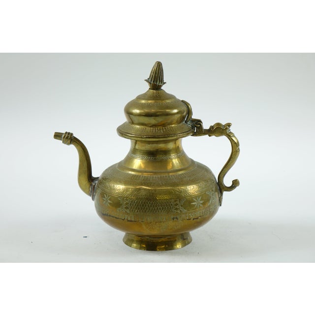 Antique Middle Eastern Brass Tea/Coffee Pot - 11” x 8” x 10.5” This exquisite antique brass tea or coffee pot is a fine...