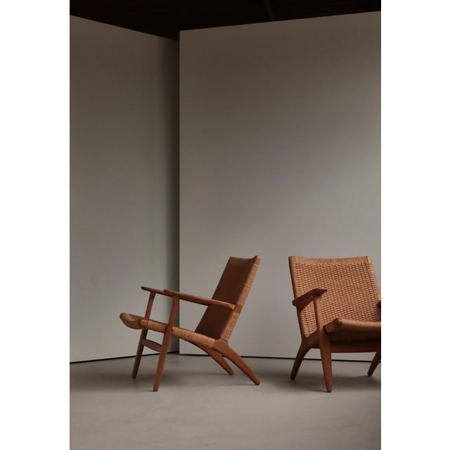 A beautifully aged and increasingly rare pair of early edition ch25 lounge chairs designed by hans j. Wegner and produced...