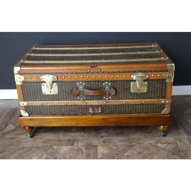 This Moynat steamer trunk features the very nice and sought after hand-painted typical 'M'-pattern canvas as well as brass...