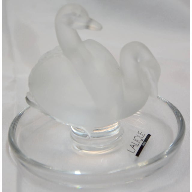 A lovely pair of swans are the focal point of this crystal ring dish by Lalique of France. This dish is named Deux Cygnes....