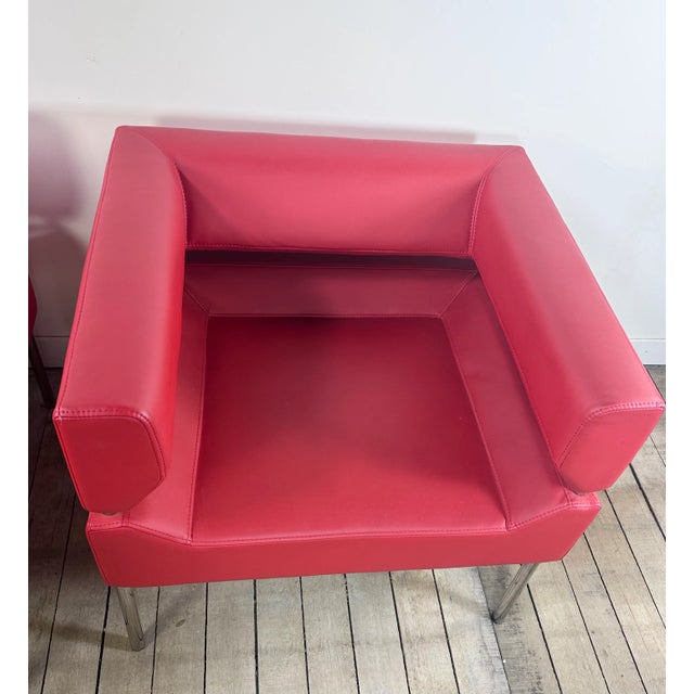 Pair of vintage 1980s red leatherette and chrome-plated aluminum armchairs A simple and elegant, timeless model that...
