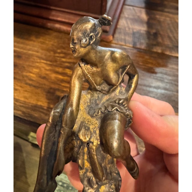 This little 19th century bronze beauty is a little disheveled on her stool. Blouse askew, leaning over to take her shoes...