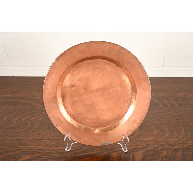A gorgeous Arts & Crafts period hand hammered copper charger, large plate, or tray In the manner of Roycroft USA, Early...