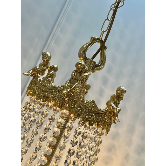 Large Putti Angels Crystal Chandelier with Gold Leaf, 1970s, in Very Good conditions. Designed 1970 to 1979 Up to 250V...