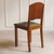 A set of four French dining chairs made of solid oak, produced in the French Art Deco style between 1920 and 1925. The...