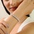 Bring timeless sparkle to your collection with this Asscher-cut CZ tennis bracelet in 925 solid silver. The 6x6 mm...
