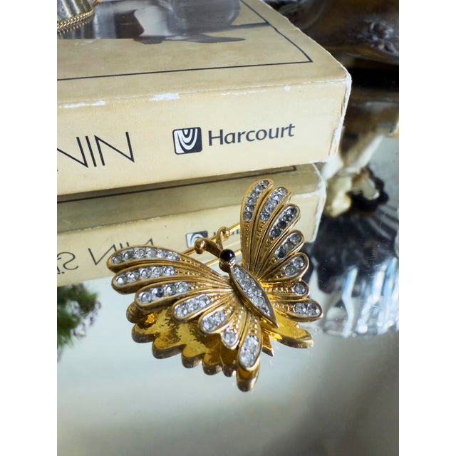 Vintage D’Orlan butterfly brooch dating to the 1970s–1980s, constructed in heavy triple gold-plated metal over a base...