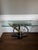 An iconic Postmodern sculptural console table designed by Kaizo Oto for Design Institute America circa 1990. This striking...