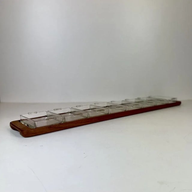 Long danish teak appetizer tray with eight glass containers from the 1960s. origin: denmarkmaker: esa design period:...