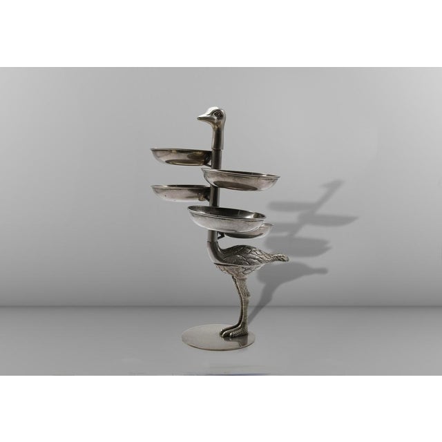 A rare and striking multi-tiered serving stand / appetiser tray, featuring a whimsical zoomorphic design in the shape of...