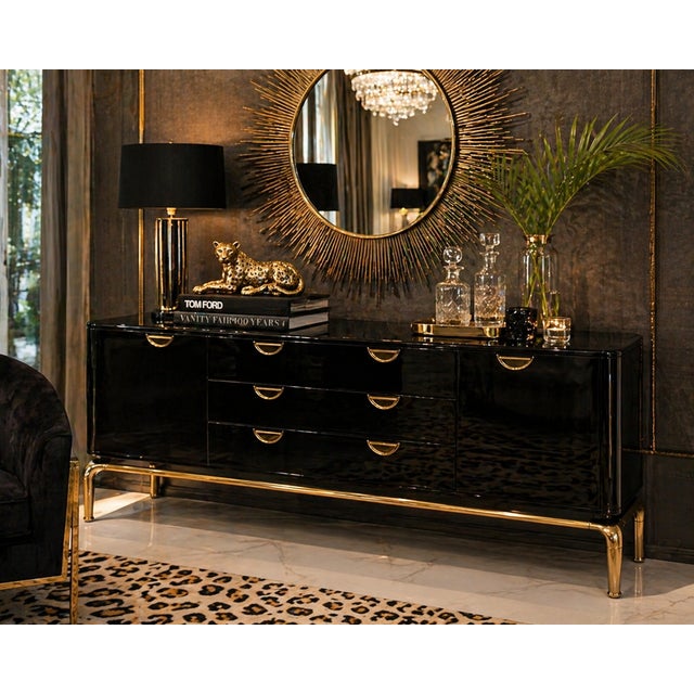 Discover the allure of this ultra-rare black lacquered credenza adorned with spectacular brass hardware and a brass base,...