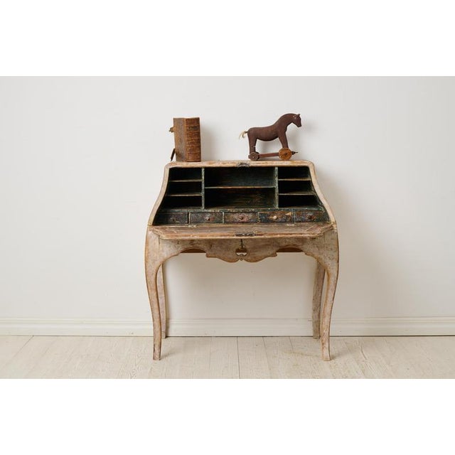 Antique period rococo secretary desk from the late 1700s. This Swedish antique is made by hand in solid pine with elegant,...