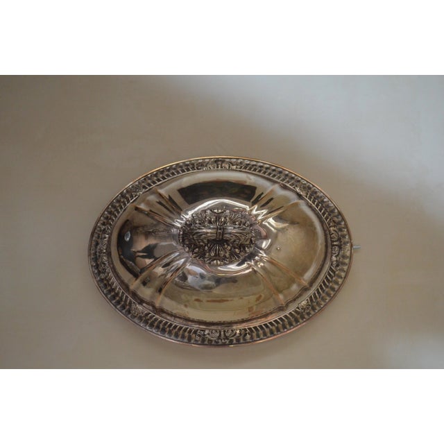 This silver plated cloche was produced in France. The base is made from copper. It is oval in shape, and arches high. The...