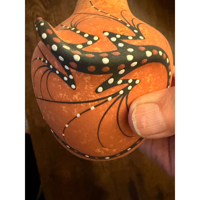 The piece dates July 1999 is handmade in New Mexico from organic clay and natural pigments, showcasing traditional Zuni...
