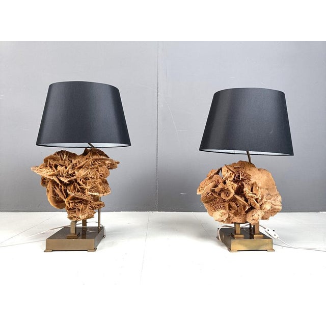 Unique mid century pair of large table lamps with a nice patinated brass base supporting two beautiful large stone rose...