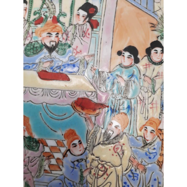 Impressive large Chinese Rose Mandarin porcelain charger, hand decorated in vibrant famille rose enamels with traditional...