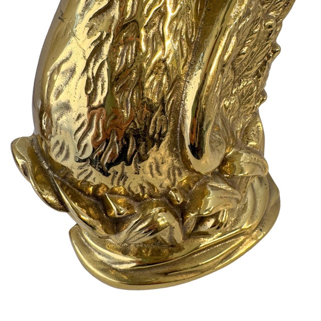 Designed in the tradition of 18th-century decorative brassware, this 1999 Virginia Metalcrafters solid brass swan doorstop...