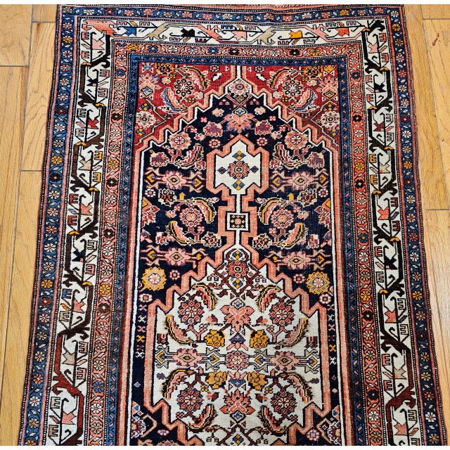 "Discover the extraordinary durability and captivating artistry of this magnificent Early 20th Century Vintage Persian...