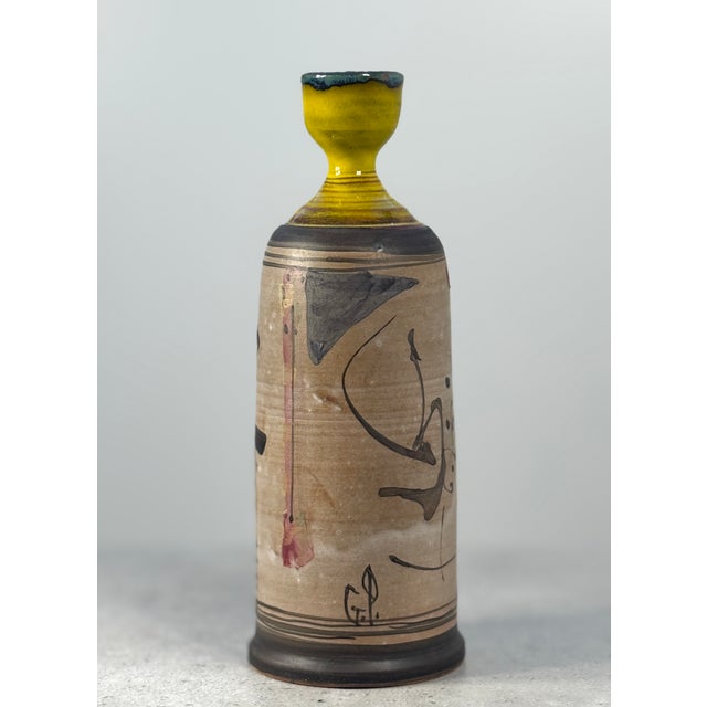 Hand-painted ceramic vase by Gilbert Portanier, made in France in the 1970s. The slender, bottle-like form with its...