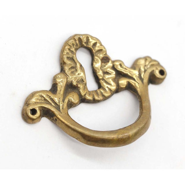 Vintage keyhole drawer pulls made of brass in an antique finish. No mounting hardware is included. Good condition with...