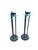 Elegant postmodern candlestick holders featuring green marble bases, sleek black rods, and transparent glass tiers. A...