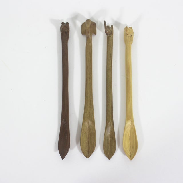 Set of four hand carved wood safari animal condiment or sugar spoons. Excellent condition. 7” long You can find other...
