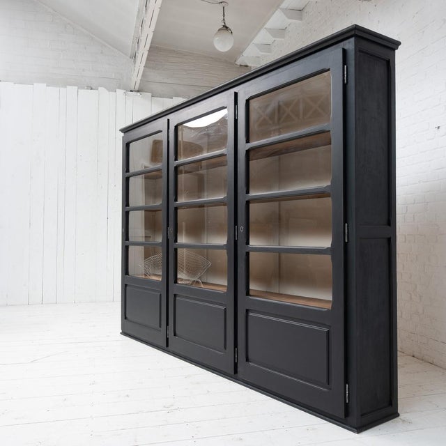 Large blackened wood bookcase - 20th century 3 lockable glass doors opening onto a series of shelves Height between...