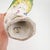 A striking and highly decorative French porcelain parrot sculpture by Porcelaine de Paris, beautifully hand-painted in...