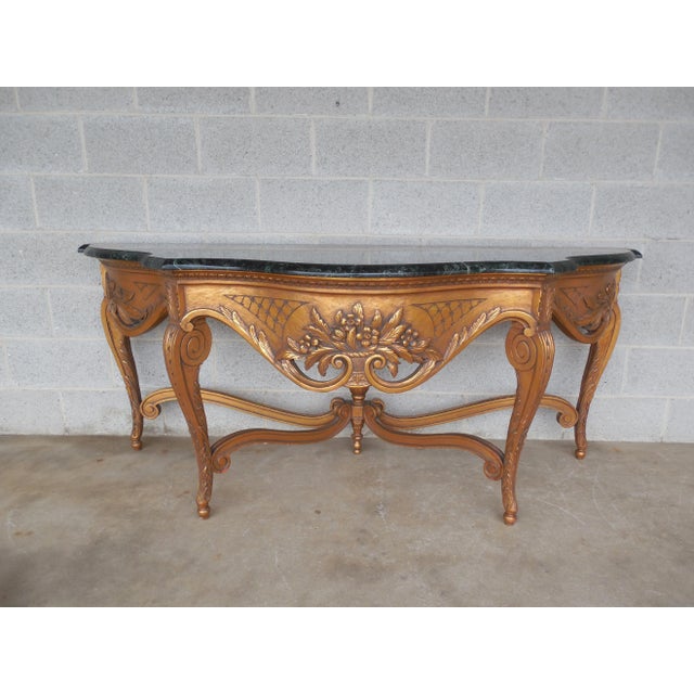 Features fine quality solid construction, 1" thick marble, an apron with a carved basket of flowers, acanthus leaf carved...