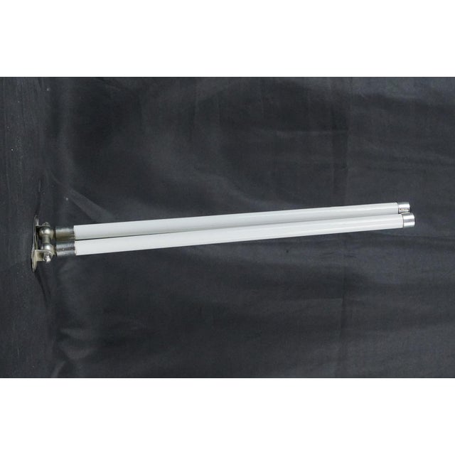 Mid Century style double arm wall mount towel rack. The bracket is made of nickel plated brass, and the rounded arms are...