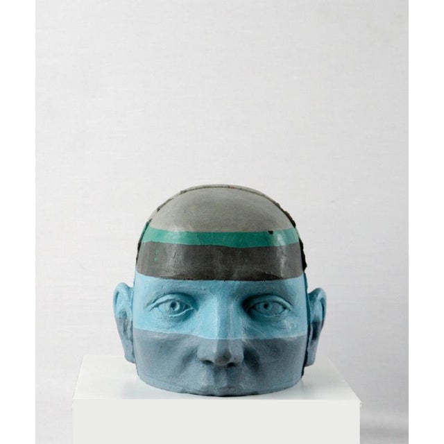 This architectural painted cement head sculpture introduces a layered chromatic vocabulary into the Proyectos subseries....